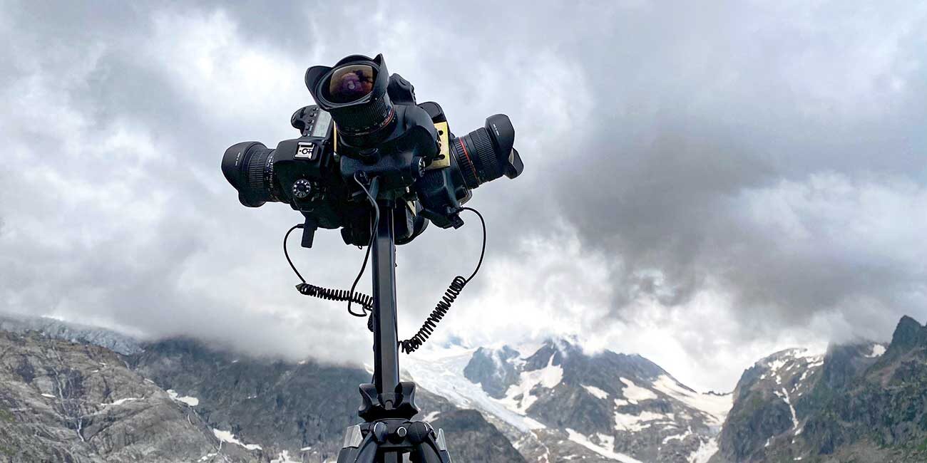 services of 360°video productions, camera in action on a mountain location with cloudy sky.