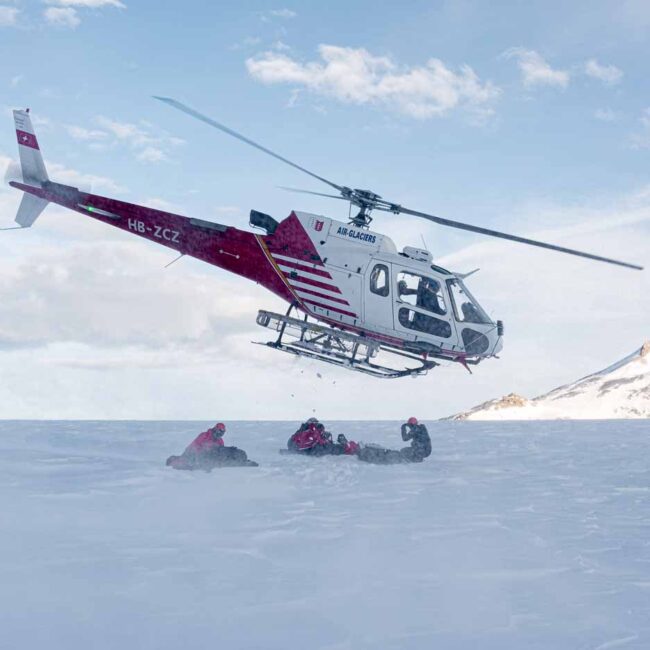 Helicopter starting on glacier Plaine Morte